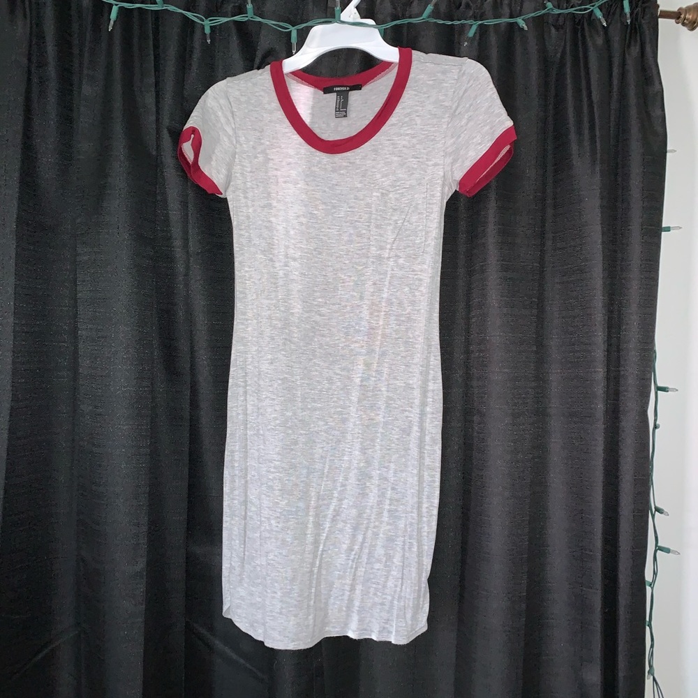 Tight, light gray dress